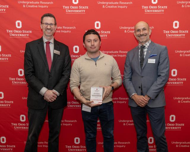 Dr. Daniel Gallego-Perez receives the Excellence in Undergraduate Research Mentoring Award with Dr. Norman Jones and Dr. Patrick Louchouarn